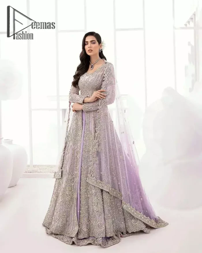 Creating the energy of modish is never been easy for a bride. So, Deemas Fashion presents the lilac front open maxi that is embellished with silver tilla, kora, and crystal soulful embroidery that all brides need for fashion. In addition to this, the V shape neckline of this maxi is looking so slayer when comes with full sleeves. Style with lilac can can lehenga that provides a glamorous look to any bride. Complete this look with a soft lilac dupatta that has a four-sided embellished border and sequins spray all over. This modish dress can be worn on your walima where you want to flaunt your style and steal everyone's heart.