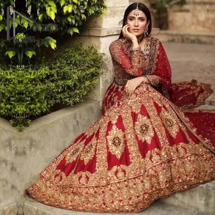 We're sure that all girls love slipping into "maroon outfits for weddings" So, we create this maroon article that will capture your moments on your big day. All details of the blouse are just amazing as it is adorned with golden tilla, kora, dabka embroidery. Just look closely at the boat shape neckline of the blouse that gives super-duper look when combine with full-length sleeves. Furthermore, it is coordinated with can can lehenga just to boost up your day by giving dreamy look. Conclude this maroon article with a chiffon dupatta that has four-sided embellished lace to capture your moments.