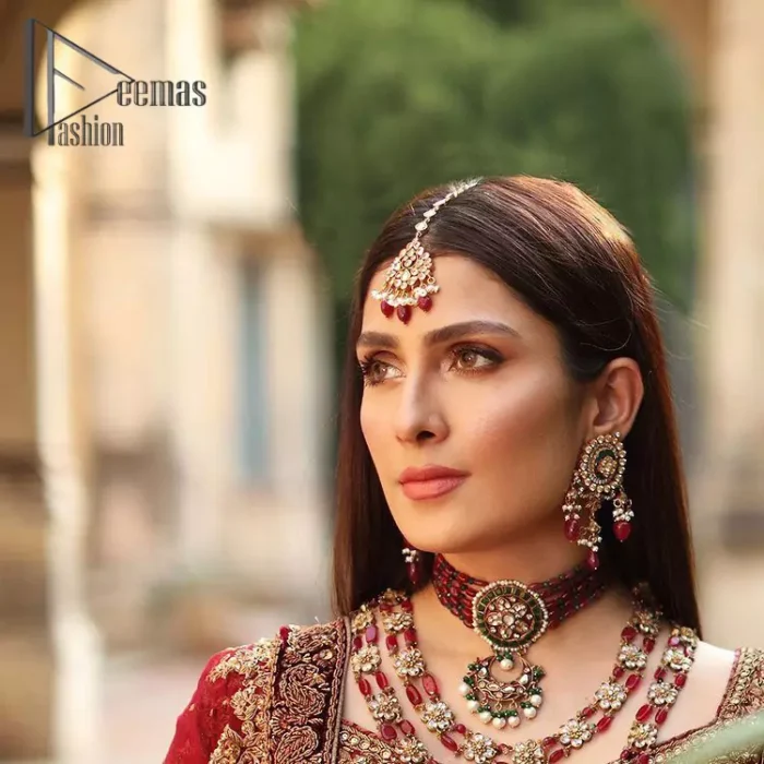 We're sure that all girls love slipping into "maroon outfits for weddings" So, we create this maroon article that will capture your moments on your big day. All details of the blouse are just amazing as it is adorned with golden tilla, kora, dabka embroidery. Just look closely at the boat shape neckline of the blouse that gives super-duper look when combine with full-length sleeves. Furthermore, it is coordinated with can can lehenga just to boost up your day by giving dreamy look. Conclude this maroon article with a chiffon dupatta that has four-sided embellished lace to capture your moments.