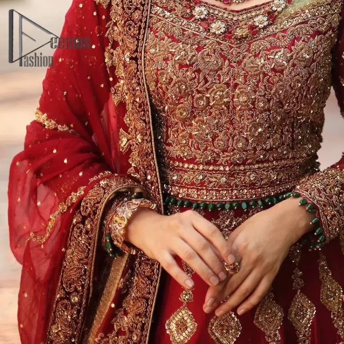 We're sure that all girls love slipping into "maroon outfits for weddings" So, we create this maroon article that will capture your moments on your big day. All details of the blouse are just amazing as it is adorned with golden tilla, kora, dabka embroidery. Just look closely at the boat shape neckline of the blouse that gives super-duper look when combine with full-length sleeves. Furthermore, it is coordinated with can can lehenga just to boost up your day by giving dreamy look. Conclude this maroon article with a chiffon dupatta that has four-sided embellished lace to capture your moments.