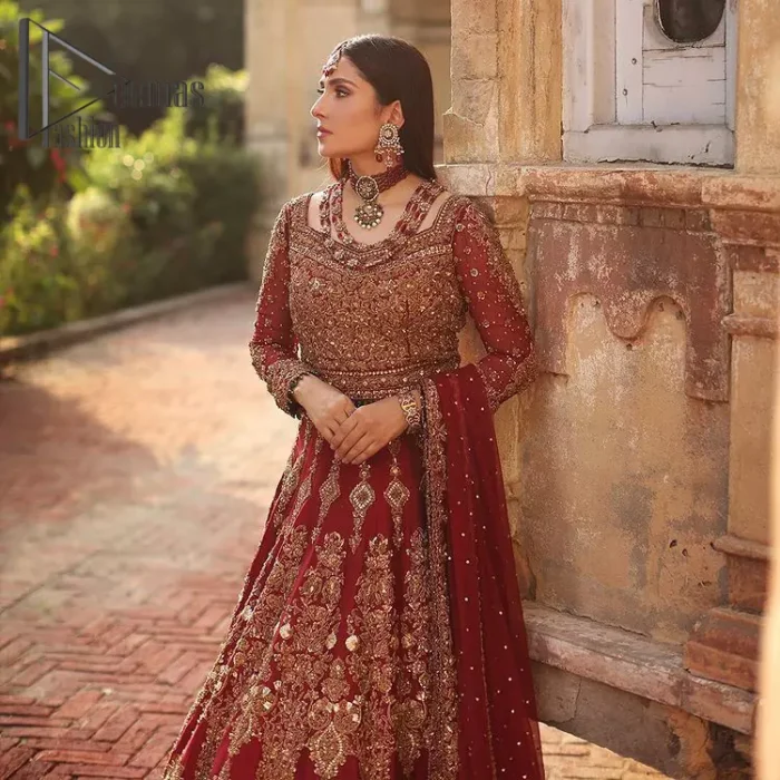 We're sure that all girls love slipping into "maroon outfits for weddings" So, we create this maroon article that will capture your moments on your big day. All details of the blouse are just amazing as it is adorned with golden tilla, kora, dabka embroidery. Just look closely at the boat shape neckline of the blouse that gives super-duper look when combine with full-length sleeves. Furthermore, it is coordinated with can can lehenga just to boost up your day by giving dreamy look. Conclude this maroon article with a chiffon dupatta that has four-sided embellished lace to capture your moments.