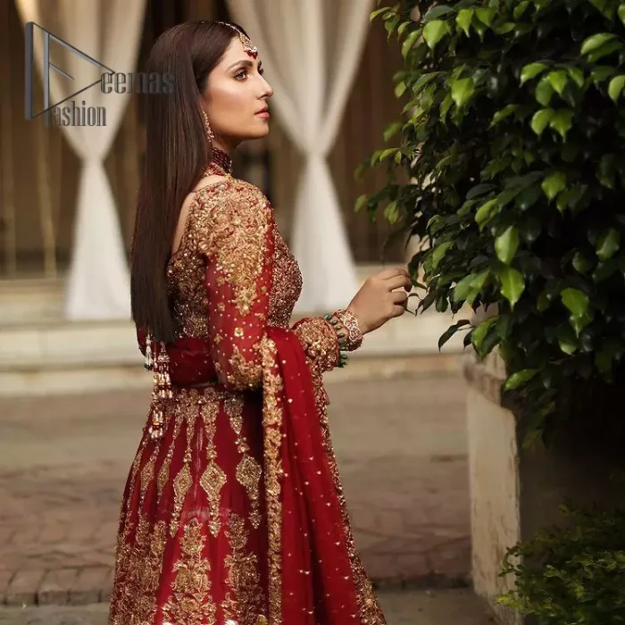 We're sure that all girls love slipping into "maroon outfits for weddings" So, we create this maroon article that will capture your moments on your big day. All details of the blouse are just amazing as it is adorned with golden tilla, kora, dabka embroidery. Just look closely at the boat shape neckline of the blouse that gives super-duper look when combine with full-length sleeves. Furthermore, it is coordinated with can can lehenga just to boost up your day by giving dreamy look. Conclude this maroon article with a chiffon dupatta that has four-sided embellished lace to capture your moments.