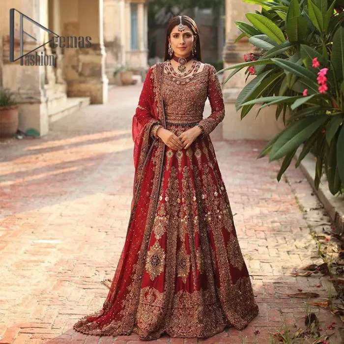 We're sure that all girls love slipping into "maroon outfits for weddings" So, we create this maroon article that will capture your moments on your big day. All details of the blouse are just amazing as it is adorned with golden tilla, kora, dabka embroidery. Just look closely at the boat shape neckline of the blouse that gives super-duper look when combine with full-length sleeves. Furthermore, it is coordinated with can can lehenga just to boost up your day by giving dreamy look. Conclude this maroon article with a chiffon dupatta that has four-sided embellished lace to capture your moments.