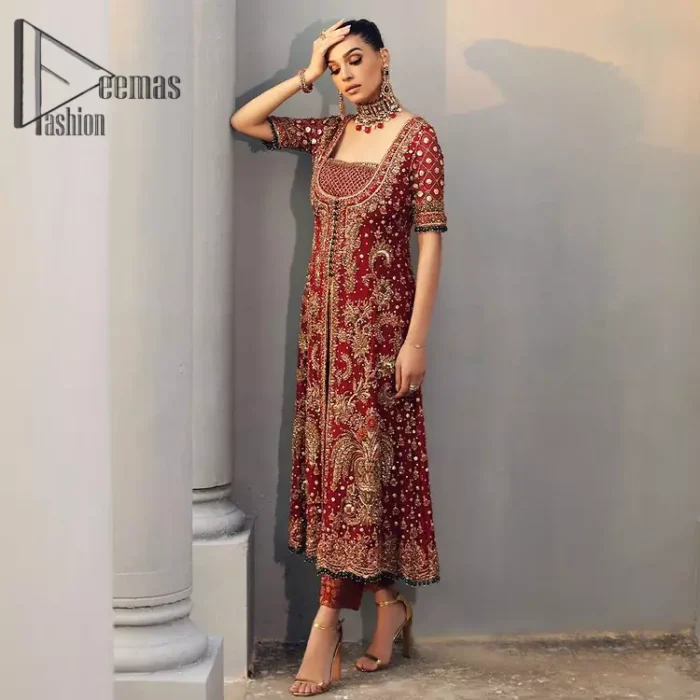 Just fulfil your love for maroon on your Big day with DeemasFashion. Giving you all the glam with this maroon scalloped front open frock which is beautifully sprinkled with antique tilla, dabka, kora, crystal, and Resham thread work. In addition to this, the square neckline and half sleeves with multicolor embroidery look so stunning and soothing on your Big day. It is attractively synchronized with cigarette pants to grant you a remarkable aesthetic focusing look.