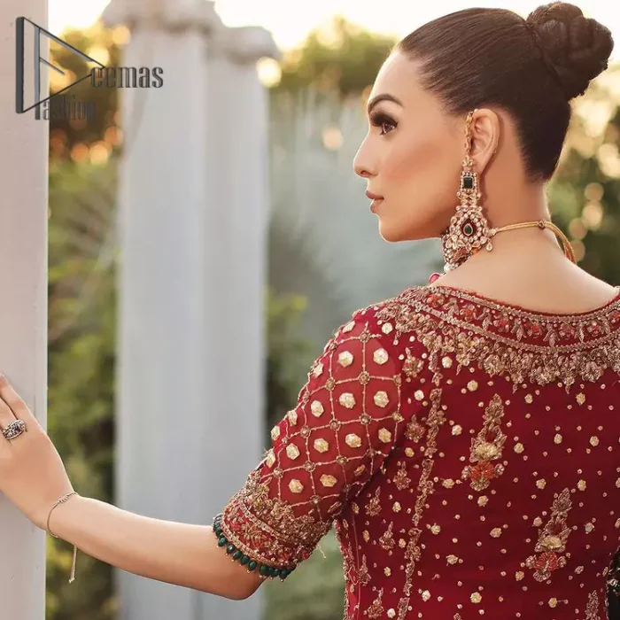 Just fulfil your love for maroon on your Big day with DeemasFashion. Giving you all the glam with this maroon scalloped front open frock which is beautifully sprinkled with antique tilla, dabka, kora, crystal, and Resham thread work. In addition to this, the square neckline and half sleeves with multicolor embroidery look so stunning and soothing on your Big day. It is attractively synchronized with cigarette pants to grant you a remarkable aesthetic focusing look.