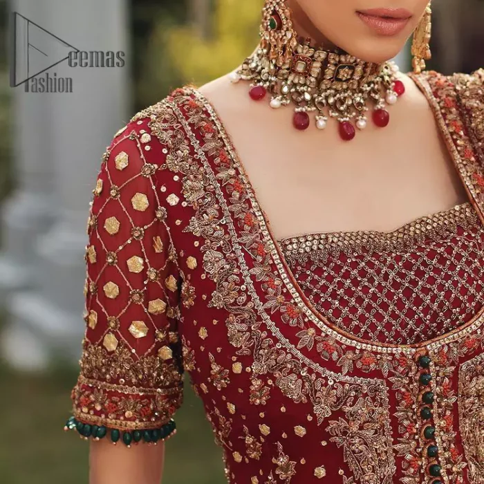 Just fulfil your love for maroon on your Big day with DeemasFashion. Giving you all the glam with this maroon scalloped front open frock which is beautifully sprinkled with antique tilla, dabka, kora, crystal, and Resham thread work. In addition to this, the square neckline and half sleeves with multicolor embroidery look so stunning and soothing on your Big day. It is attractively synchronized with cigarette pants to grant you a remarkable aesthetic focusing look.