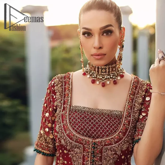 Just fulfil your love for maroon on your Big day with DeemasFashion. Giving you all the glam with this maroon scalloped front open frock which is beautifully sprinkled with antique tilla, dabka, kora, crystal, and Resham thread work. In addition to this, the square neckline and half sleeves with multicolor embroidery look so stunning and soothing on your Big day. It is attractively synchronized with cigarette pants to grant you a remarkable aesthetic focusing look.