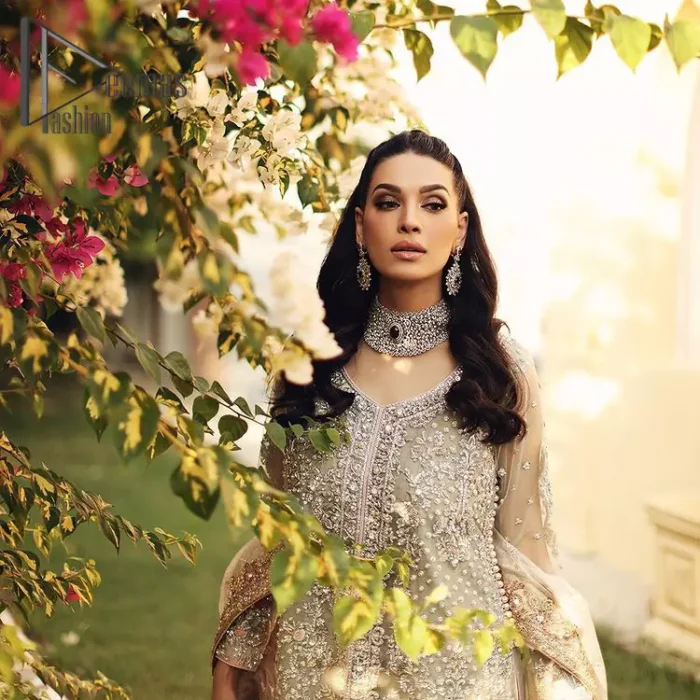 It's time to stock up your eventry wardrobe with the ensembles that have everyone hooked. Your mini fashionistas got stunned in this mint green and rust attire. Just look at the super detailing of a mint green front open shirt that is ornamented with silver embroidery that includes tilla, kora dabka, and crystal work. It is further enhanced with a Round neckline that gives so soothing display. It is coordinated with a Rust sharara, the border is sprinkled with silver embroidery and sequins spray all over that looks just priceless at any party. End up this attire with an ivory dupatta with a four-sided embellished border.