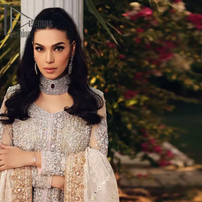 It's time to stock up your eventry wardrobe with the ensembles that have everyone hooked. Your mini fashionistas got stunned in this mint green and rust attire. Just look at the super detailing of a mint green front open shirt that is ornamented with silver embroidery that includes tilla, kora dabka, and crystal work. It is further enhanced with a Round neckline that gives so soothing display. It is coordinated with a Rust sharara, the border is sprinkled with silver embroidery and sequins spray all over that looks just priceless at any party. End up this attire with an ivory dupatta with a four-sided embellished border.