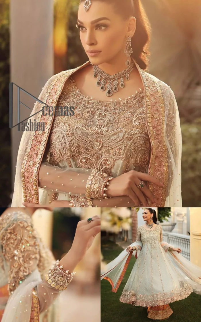 Unveiling your inner happiness is what it's all about your outfit. Just seep royalty in the texture and layers of this mint green scalloped maxi of DeemasFashion. The round neckline of the maxi is looking super aesthetic when comes with full sleeves. Further, the maxi is beautifully adorned with golden and antique embroidery that includes mainly tilla, gota, and crystal work just to give you a soothing and amazing look. Marvellously maxi is paired up with rust sharara with embroidered border to express your happiness as well. Finish this look with a mint green dupatta that is highlighted with a rust border and sequins spray all over it that seeps the royalty of the article.