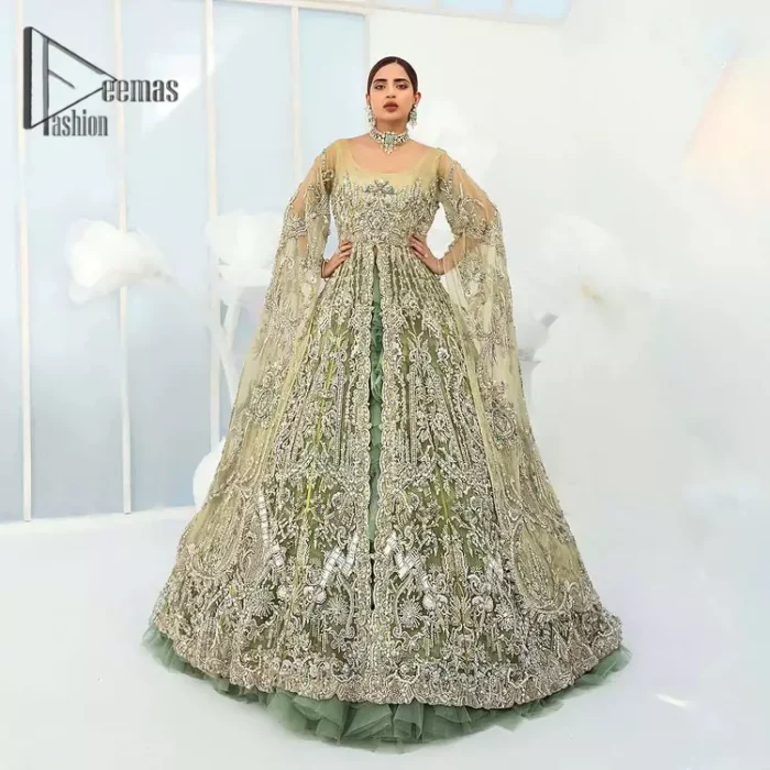 Confected on a luxury outfit with spectacular colors and contrast, this style serves for an elevated look. Delicate embroidery of maxi that involves kora, dabka, crystal work and front open style of maxi are infused together for the olive green affair. The very unbelievable sleeve style of the maxi looks super stunning and jazz up your event wardrobe. It is gracefully synchronized with a full frilled lehenga to enhance the beauty of the article. Complete this stunning look with an olive green scalloped dupatta that is embellished with four-sided borders and small motifs all around that reflect the mood of everyone.