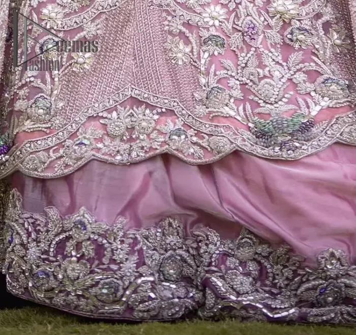 If you want to go high on the fashion charts then just go with this pink outfit of Deemas Fashion. This full sleeve pink pishwas is certainly any girl's dream that is fully embellished with multiple colour thread embroidery and silver zardozi work that includes kora, dabka, and crystal work to get so cool look. Furthermore, the boat shape neckline of this pishwas is just increasing the focus of this article. It is synchronized with the back train frilled lehenga to enhance your beauty on any occasion.