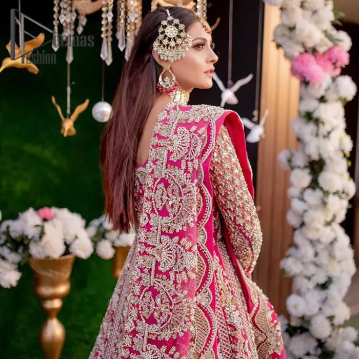 A colour splash, a floral dream. Let your energy shine with this pink outfit. Make a dramatic entry with pink scalloped pishwas that's full sleeves look super-duper amazing when combine with boat shape neckline. It is streaking with the finest silver and light golden embroidery that counts in tilla, kora, dabka, and crystal work to give you an enthusiast look. Further, this scalloped pishwas is coordinated with a Pink dupatta that is adorned with four-sided borders and sequins spray all over to give you shiny energy at any party.