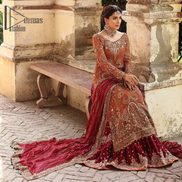 Wondering what an aesthetic bridal attire looks like? The beauty in red makes you go gaga over your look and you cannot stop snowing over you. Wearing the rust long shirt on your big day that is marvellously adorned with kora, dabka, and sequins work. Furthermore, the round neckline is also beautifully decorated to enhance the beauty of the outfit. It is synchronized with a red lehenga that has sequins sprayed all over to give you a crazy look as well. Finish this look with a red dupatta that has four-sided embellished borders as well.
