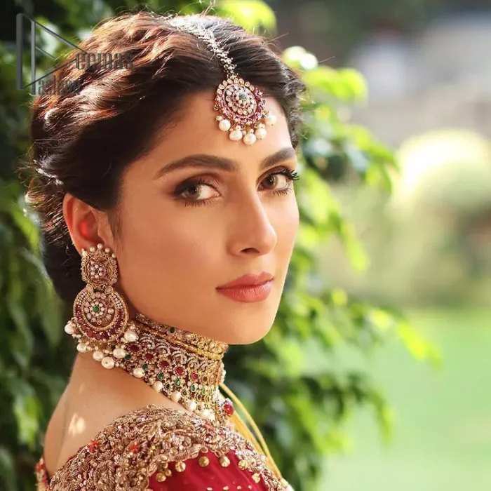 Wondering what an aesthetic bridal attire looks like? The beauty in red makes you go gaga over your look and you cannot stop snowing over you. Wearing the rust long shirt on your big day that is marvellously adorned with kora, dabka, and sequins work. Furthermore, the round neckline is also beautifully decorated to enhance the beauty of the outfit. It is synchronized with a red lehenga that has sequins sprayed all over to give you a crazy look as well. Finish this look with a red dupatta that has four-sided embellished borders as well.