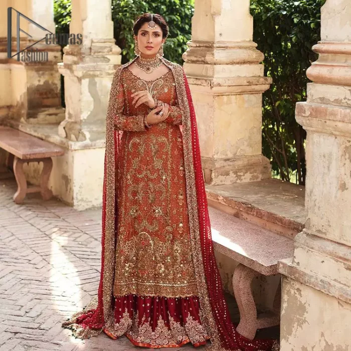 Wondering what an aesthetic bridal attire looks like? The beauty in red makes you go gaga over your look and you cannot stop snowing over you. Wearing the rust long shirt on your big day that is marvellously adorned with kora, dabka, and sequins work. Furthermore, the round neckline is also beautifully decorated to enhance the beauty of the outfit. It is synchronized with a red lehenga that has sequins sprayed all over to give you a crazy look as well. Finish this look with a red dupatta that has four-sided embellished borders as well.