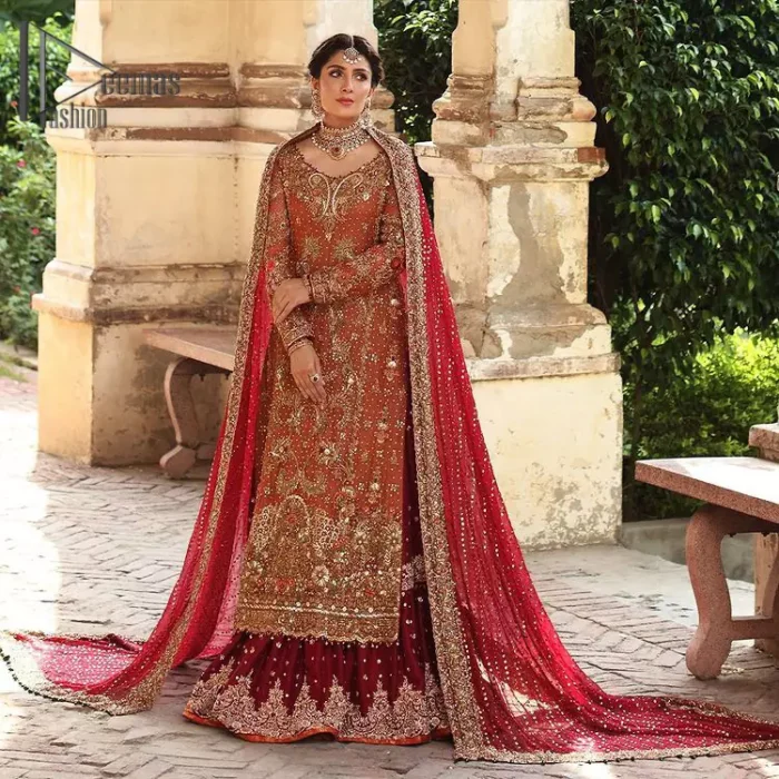 Wondering what an aesthetic bridal attire looks like? The beauty in red makes you go gaga over your look and you cannot stop snowing over you. Wearing the rust long shirt on your big day that is marvellously adorned with kora, dabka, and sequins work. Furthermore, the round neckline is also beautifully decorated to enhance the beauty of the outfit. It is synchronized with a red lehenga that has sequins sprayed all over to give you a crazy look as well. Finish this look with a red dupatta that has four-sided embellished borders as well.