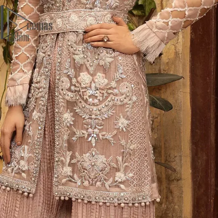 Nothing spells magic quite like a tea rose outfit on your big day. An engrossing shirt and crushed sharara style provide unparalleled majesty and impressiveness to the overall dress code all made with the purest of the tissue. This tea rose full sleeve shirt is heavily embellished with silver embroidery that includes pearls, kora and dabka work. Our attire and the way we put ourselves together sometimes speaks louder than our words. So, we set it up with tea rose crushed sharara to balance the magical fairytale look.