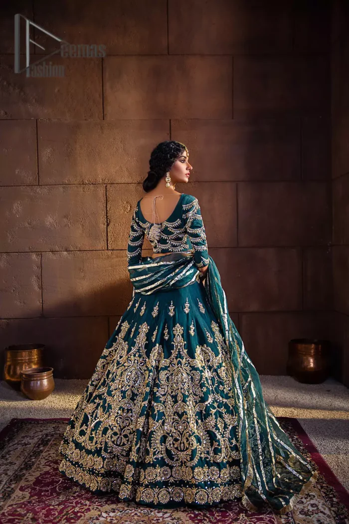 Make your day swirl and twirl in our teal blue outfit. This full sleeves teal blue blouse embellished with kora, dabka and tilla work looks stunning. Further, the boat shape neckline of this blouse is based on floral embroidery and made with pure organza. The dress accompanies a fascinating organza dupatta to perfect the beautiful formal wear. It is highlighted with a lehenga that has the power to make your look even just like the delphinium flower. The outfit enhances its beauty due to its uniqueness and the perfect fusion of modern cut and traditional embroidery.