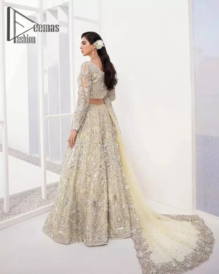 A dream come true for girls who love to play with their looks in a fashionable look. We don't even miss adding the finest details to our outfits so that's why the blouse is embellished with silver embroidery that involves kora, dabka, and tilla work to shoot up the first-rate look. Furthermore, the full sleeves of blouse and round neckline gives so splendid look when comes together.Gracefully, It is pair up with stunning and beautifull vanilla lehenga to fulfill your dream. Finish this look with dupatta that is embellished with four-sided borders and sequins spray all over to give you a fashionable look.
