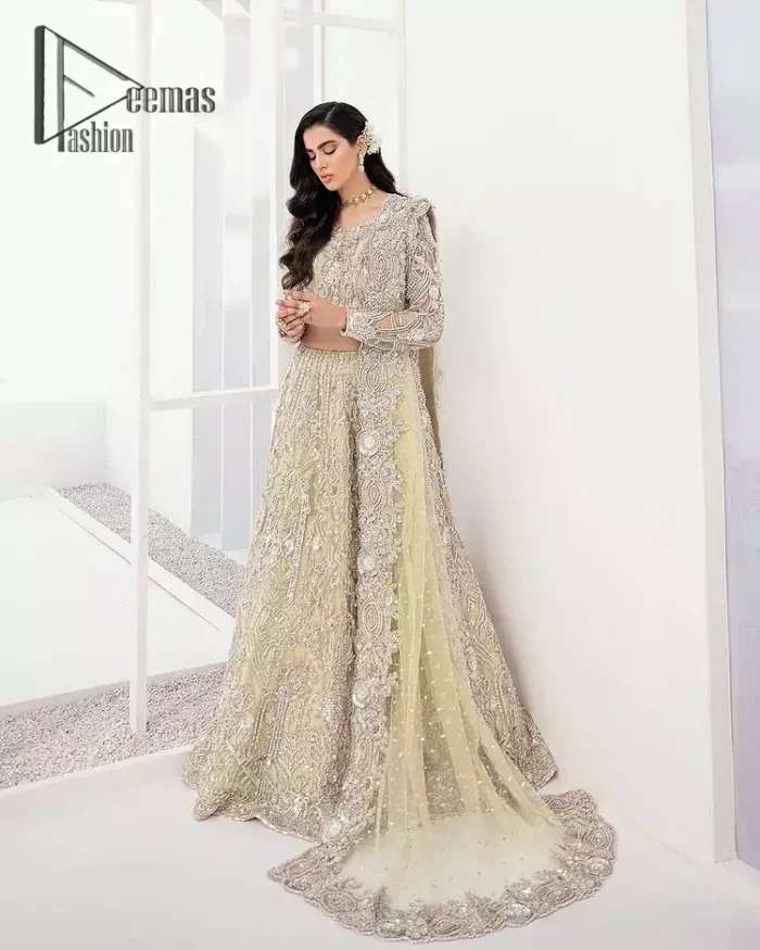 A dream come true for girls who love to play with their looks in a fashionable look. We don't even miss adding the finest details to our outfits so that's why the blouse is embellished with silver embroidery that involves kora, dabka, and tilla work to shoot up the first-rate look. Furthermore, the full sleeves of blouse and round neckline gives so splendid look when comes together.Gracefully, It is pair up with stunning and beautifull vanilla lehenga to fulfill your dream. Finish this look with dupatta that is embellished with four-sided borders and sequins spray all over to give you a fashionable look.