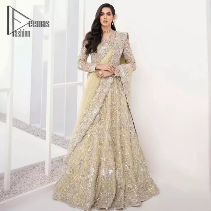 A dream come true for girls who love to play with their looks in a fashionable look. We don't even miss adding the finest details to our outfits so that's why the blouse is embellished with silver embroidery that involves kora, dabka, and tilla work to shoot up the first-rate look. Furthermore, the full sleeves of blouse and round neckline gives so splendid look when comes together.Gracefully, It is pair up with stunning and beautifull vanilla lehenga to fulfill your dream. Finish this look with dupatta that is embellished with four-sided borders and sequins spray all over to give you a fashionable look.