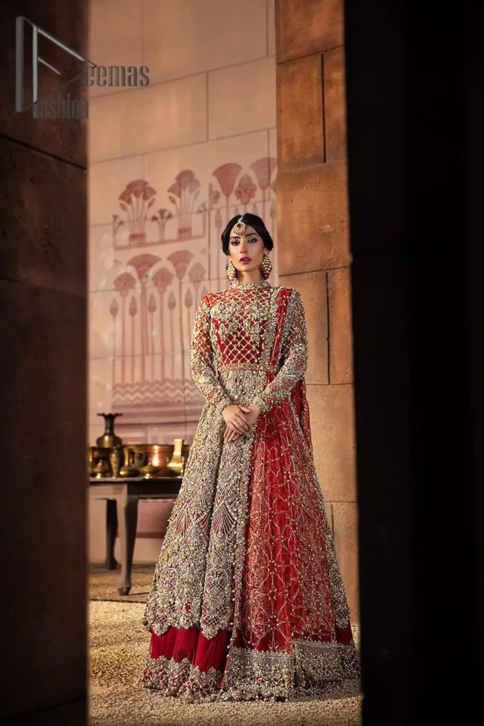 There are days in life when you fall in love with red love tone. As every bride wants red for her big day so DeemasFashion presents a bright red maxi that is heavily ornamented with golden embroidery just to make you a relaxing and romantic bride. The maxi is prominent with a jewel neckline which is added super aesthetics to your outfit. In addition to this, the full sleeves of maxi are just priceless and highlighted with kora, dabka, and tilla work. It is coordinated with the same color lehenga that's the border is heavily embellished with golden embroidery as well. Conclude this outfit with a bright red dupatta to add just the right amount to your bridal look.
