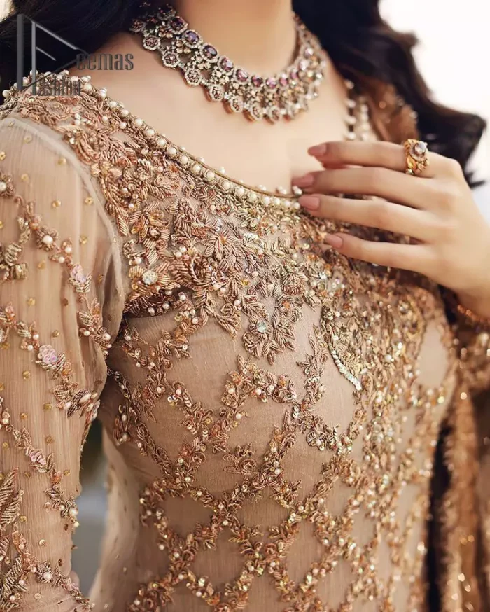 Opt for a versatile outfit for your Nikkah that is the perfect amalgamation of splendid colours, deluxe fabrication, and exquisite profile as well. Satiate your soul with extraordinary ensembles from this fawn short shirt gharara of DeemasFashion outfits. The round neckline of the short shirt is just amazing when combine with full sleeves. Further, it is highlighted with antique embroidery that includes tilla, kora, and dabka work. Pair up it with fawn gharara made with pure Katan banarsi jamawar fabric just to grant you a super aesthetic look. Complete this outfit with a fawn dupatta that is embellished with a four-sided embellished border and kiran lace as well.