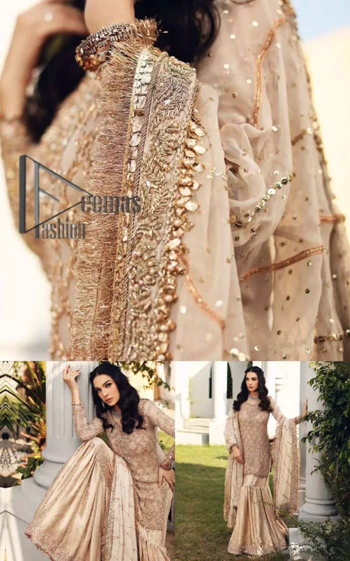 Opt for a versatile outfit for your Nikkah that is the perfect amalgamation of splendid colours, deluxe fabrication, and exquisite profile as well. Satiate your soul with extraordinary ensembles from this fawn short shirt gharara of DeemasFashion outfits. The round neckline of the short shirt is just amazing when combine with full sleeves. Further, it is highlighted with antique embroidery that includes tilla, kora, and dabka work. Pair up it with fawn gharara made with pure Katan banarsi jamawar fabric just to grant you a super aesthetic look. Complete this outfit with a fawn dupatta that is embellished with a four-sided embellished border and kiran lace as well.