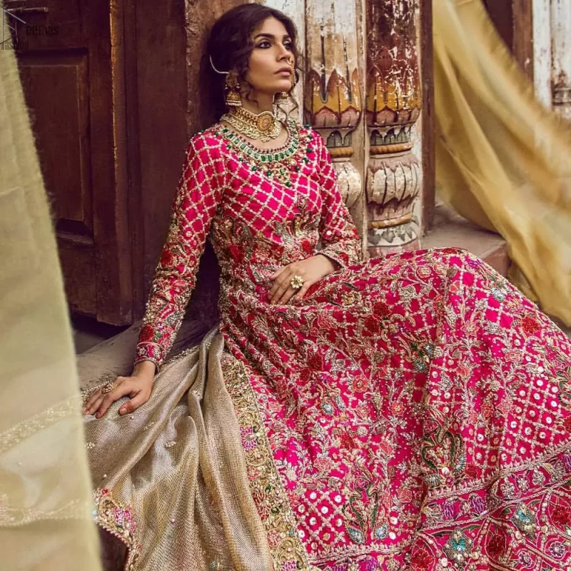 Feminine beauty needs delicate care, henceforth, Deemas Fashion introduces the most iconic bridal wears, enriched with exquisiteness at its rapture. The Mehndi Wear Shocking Pink Blouse Lehenga is the finest choice considering its gorgeousness and comfort. The dress is meticulously designed in full-sleeves, keeping the ancient royal touch preserved while the multicolour embroidery under its the extremely admirable round neckline, is just the right traditional flavour to the dress's ravishing. The designers made sure to choose the finest fabric, which is why the overall attire is made to perfection by using the purest organza. Concluding this paragon of beauty, a net dupatta sets the dress complete to glamour up your Mehendi or Walima.