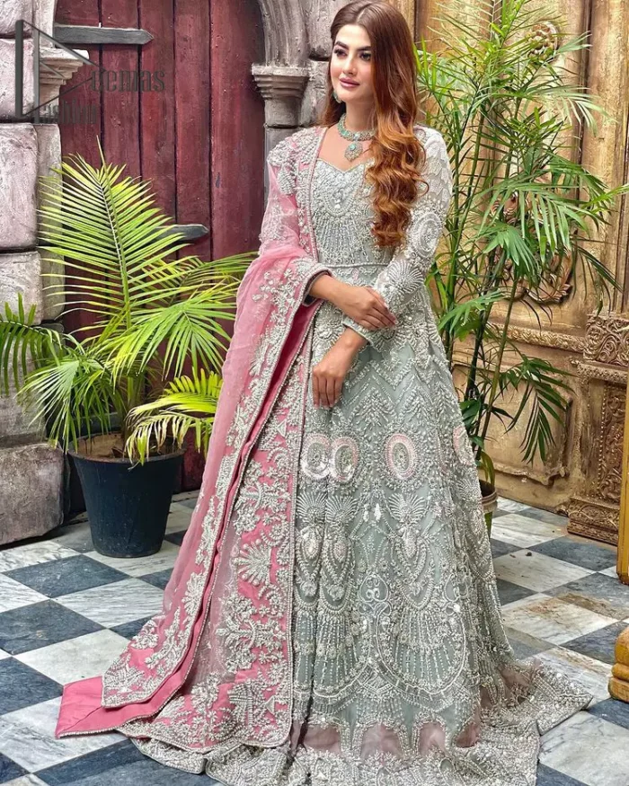 Need a quick fantastic pick for you walima? So you're in the right place. DeemasFashion presents mint green heavy maxi that is delightfully ornamented with silver embroidery that includes kora, dabka, pearl, antique, and crystal work just to give you a lovely and pleasing look. In addition to this, the V neckline of the maxi is super stunning when comes to the combination of attractive full sleeves. It is coordinated with a pink dupatta that is embellished with four-sided beautiful embroidery just to steal your special one's heart on your walima day.
