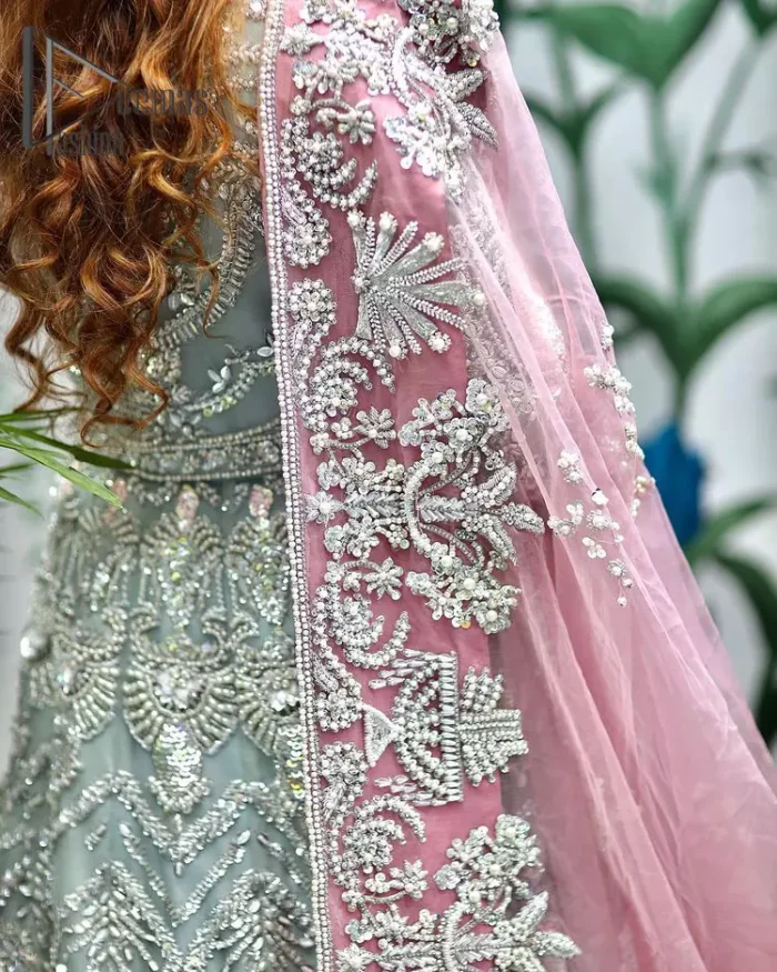 Need a quick fantastic pick for you walima? So you're in the right place. DeemasFashion presents mint green heavy maxi that is delightfully ornamented with silver embroidery that includes kora, dabka, pearl, antique, and crystal work just to give you a lovely and pleasing look. In addition to this, the V neckline of the maxi is super stunning when comes to the combination of attractive full sleeves. It is coordinated with a pink dupatta that is embellished with four-sided beautiful embroidery just to steal your special one's heart on your walima day.