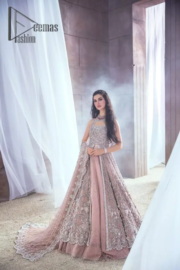 Rose, glitter, and glam are the mood. Shine through with all eyes on you! A full festive package dipped in an oyster pink tone. Presenting oyster pink front open maxi for your Walima day just to boost up your inner happiness. The maxi is handsomely adorned with silver embroidery that is embellished with tilla, kora, dabka, and pearls work. Furthermore, it is highlighted with full sleeves just to give you glam and shiny look. It is systemized with an oyster pink lehenga to give you a superstar look. End up this article with the same colour dupatta that is prominent with a four-sided embellished border and sequins spray all over.