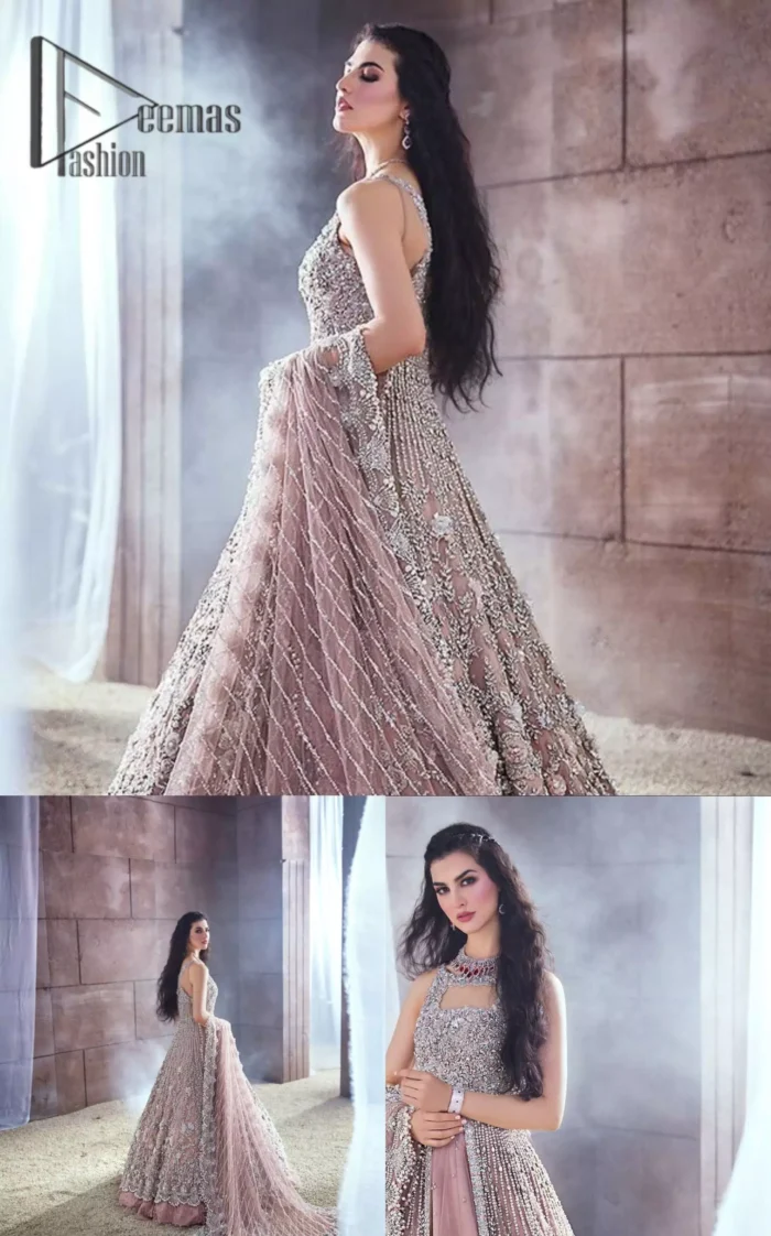 Rose, glitter, and glam are the mood. Shine through with all eyes on you! A full festive package dipped in an oyster pink tone. Presenting oyster pink front open maxi for your Walima day just to boost up your inner happiness. The maxi is handsomely adorned with silver embroidery that is embellished with tilla, kora, dabka, and pearls work. Furthermore, it is highlighted with full sleeves just to give you glam and shiny look. It is systemized with an oyster pink lehenga to give you a superstar look. End up this article with the same colour dupatta that is prominent with a four-sided embellished border and sequins spray all over.