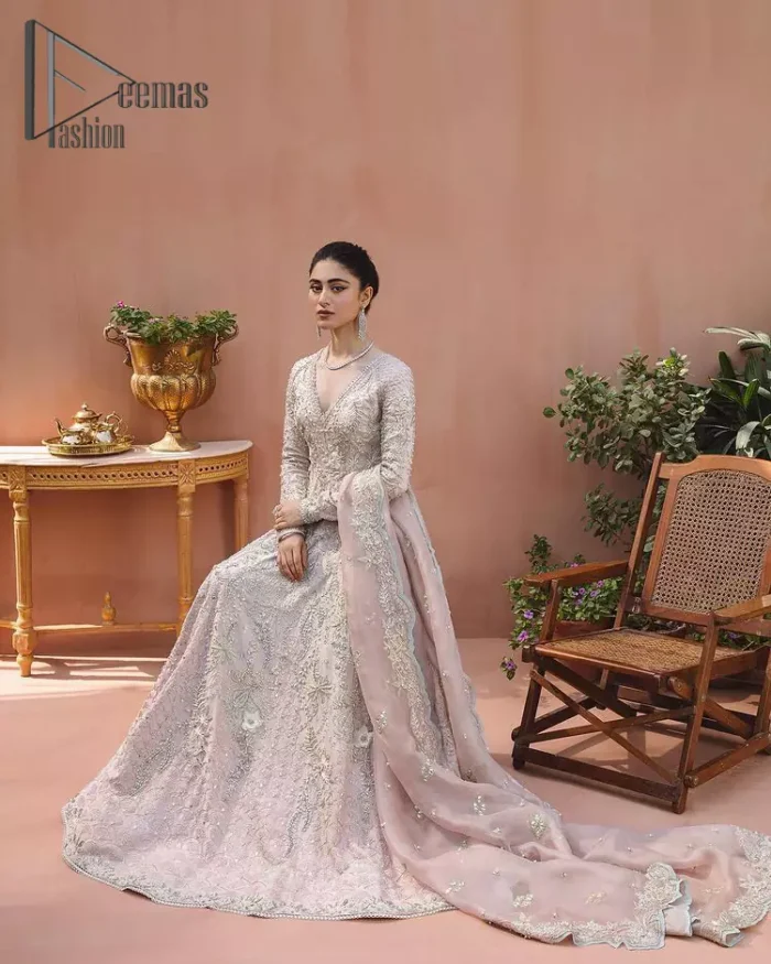 A true epitome of elegance. Confected ever so beautifully with the oyster pink colour palette and eye-catching embroidery. The ouster pink maxi is splendid just because of its multiple colour embroidery which is involved with tilla, dabka, kora and pearls. Further, it is prominent with its V shape neckline that grants pleasure to you on your walima day when combine with full sleeves. Complete this oyster pink outfit with a dupatta that is ornamented with embellished border and sequins spray just to fulfil your dream.