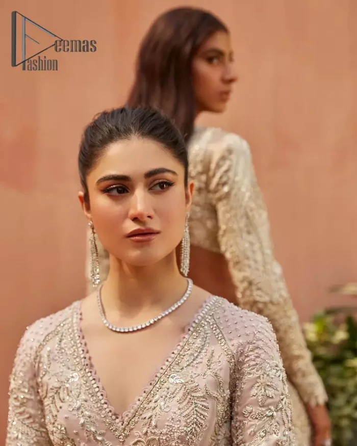 A true epitome of elegance. Confected ever so beautifully with the oyster pink colour palette and eye-catching embroidery. The ouster pink maxi is splendid just because of its multiple colour embroidery which is involved with tilla, dabka, kora and pearls. Further, it is prominent with its V shape neckline that grants pleasure to you on your walima day when combine with full sleeves. Complete this oyster pink outfit with a dupatta that is ornamented with embellished border and sequins spray just to fulfil your dream.