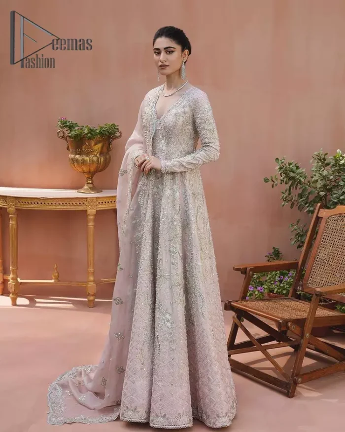 A true epitome of elegance. Confected ever so beautifully with the oyster pink colour palette and eye-catching embroidery. The ouster pink maxi is splendid just because of its multiple colour embroidery which is involved with tilla, dabka, kora and pearls. Further, it is prominent with its V shape neckline that grants pleasure to you on your walima day when combine with full sleeves. Complete this oyster pink outfit with a dupatta that is ornamented with embellished border and sequins spray just to fulfil your dream.