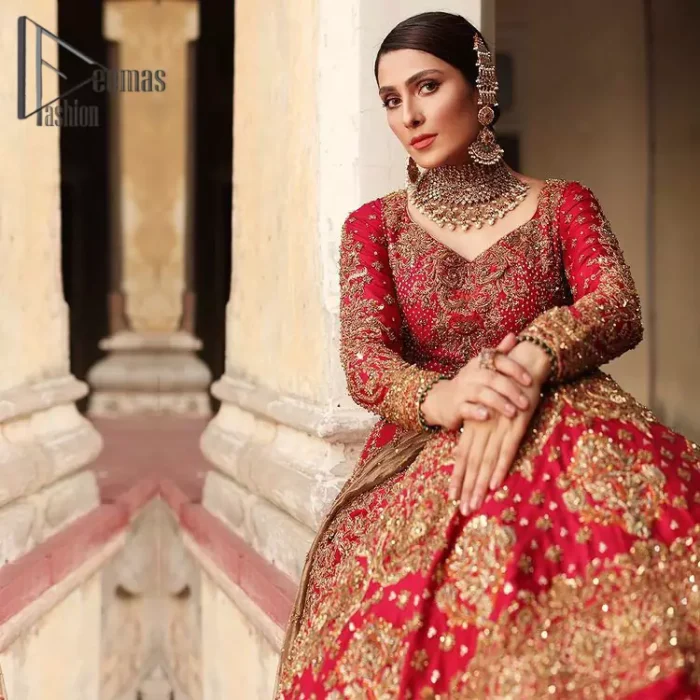 Dress up for your occasion, it's time to dance on your big day. Give a fresh twist to your wedding Big day outfits with this eye-catching red article. Reveal your day with the red heavy blouse that is attractively adorned with golden embroidery which includes tilla, dabka, kora work so that you can embezzle everyone's attraction. In addition to this, the sweetheart neckline of the blouse is just soothing when comes with full sleeves. The blouse is coordinated with a red lehenga that is heavily embellished with marvellous embroidery to give you a queen look. Complete this outfit with a golden dupatta which enhanced the beauty of the outfit.