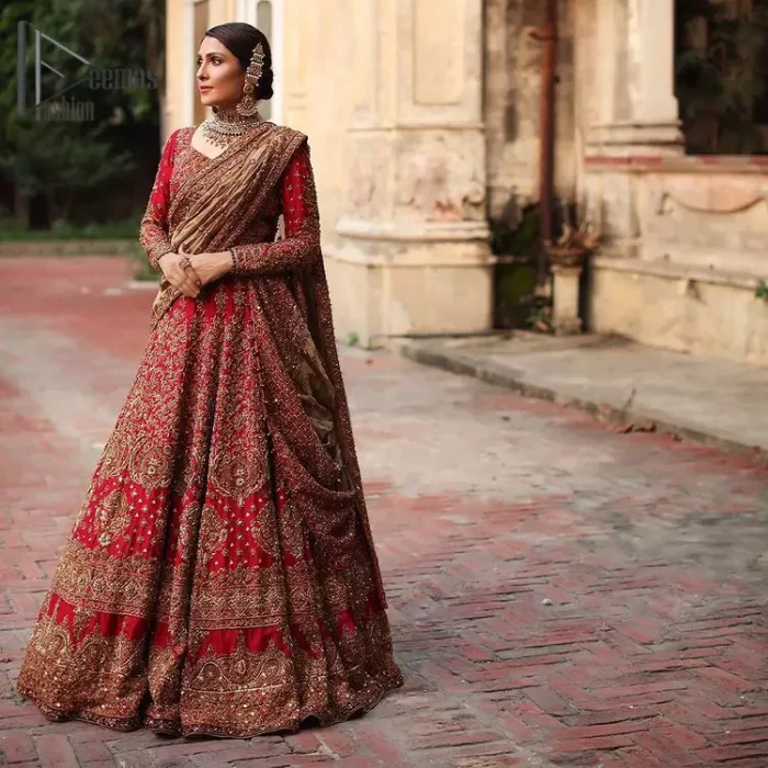 Dress up for your occasion, it's time to dance on your big day. Give a fresh twist to your wedding Big day outfits with this eye-catching red article. Reveal your day with the red heavy blouse that is attractively adorned with golden embroidery which includes tilla, dabka, kora work so that you can embezzle everyone's attraction. In addition to this, the sweetheart neckline of the blouse is just soothing when comes with full sleeves. The blouse is coordinated with a red lehenga that is heavily embellished with marvellous embroidery to give you a queen look. Complete this outfit with a golden dupatta which enhanced the beauty of the outfit.