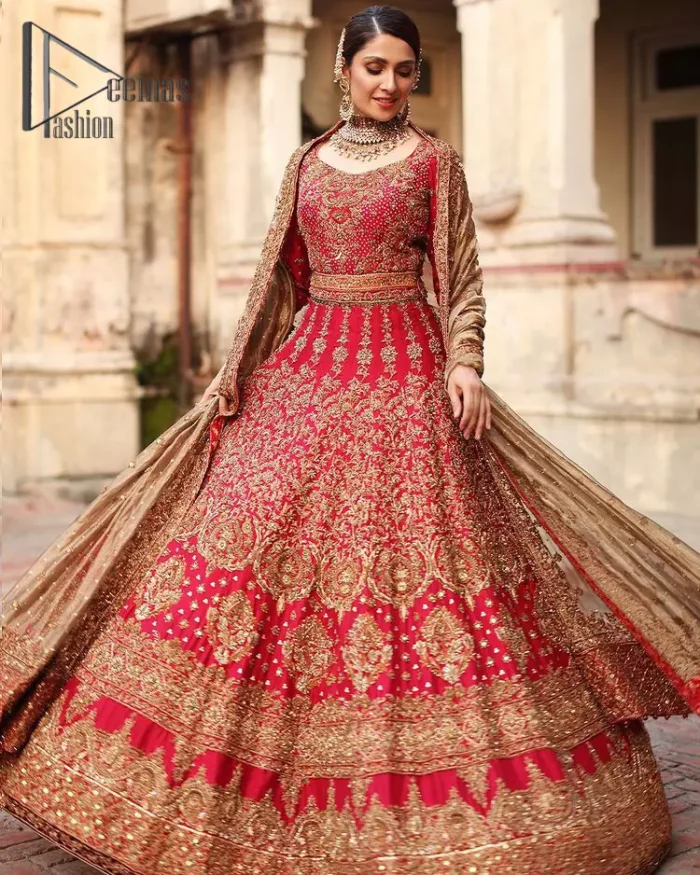 Dress up for your occasion, it's time to dance on your big day. Give a fresh twist to your wedding Big day outfits with this eye-catching red article. Reveal your day with the red heavy blouse that is attractively adorned with golden embroidery which includes tilla, dabka, kora work so that you can embezzle everyone's attraction. In addition to this, the sweetheart neckline of the blouse is just soothing when comes with full sleeves. The blouse is coordinated with a red lehenga that is heavily embellished with marvellous embroidery to give you a queen look. Complete this outfit with a golden dupatta which enhanced the beauty of the outfit.