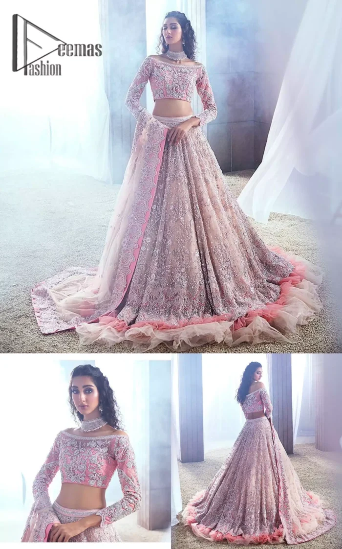 DeemasFashion just defines sophistication and minimal high fashion in terms you desire. Reveal your aura in this tea pink off-shoulder blouse that is beautifully decorated with silver embroidery that involves a kora, dabka, tilla, and crystal look just to grant you mesmerizing look. Further, the full sleeves of the blouse look so admiring on your walima day. It is arranged with a frilled lehenga again which is ornamented with heavy silver embroidery so that you can steal everyone's heart. Finish this article with a tea pink dupatta that is prominent with four-sided border embellishment.