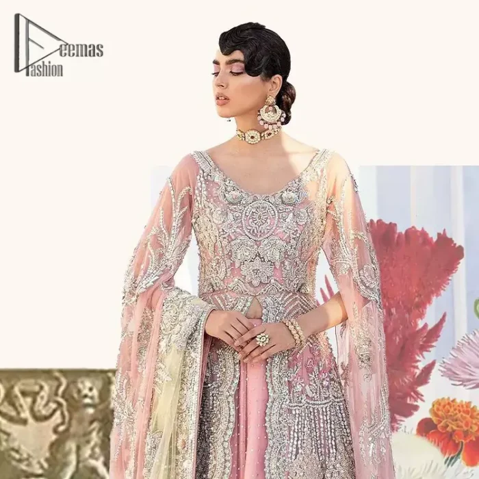 Wants regal, striking, and bold? Our tea pink maxi is all you need to bring out the queen in you. Detailing this tea pink maxi is as amazing as the front open style of maxi. Maxi is prominent with silver embroidery that involves kora, dabka, tilla, and crystal work to give you a bold and regal look on your walima day. Further, it looks super stunning when full sleeves combine with a round neckline. The maxi is coordinated with a double tone lehenga that the bottom side reflects the yellow colour to give an aesthetic and stunning look. Complete this article with the same colour dupatta that is embellished with a four-sided border.