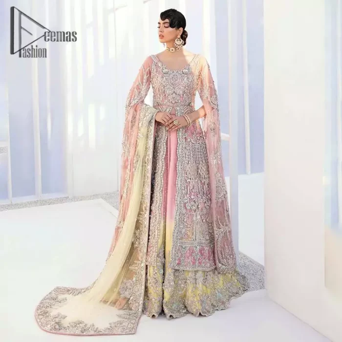 Wants regal, striking, and bold? Our tea pink maxi is all you need to bring out the queen in you. Detailing this tea pink maxi is as amazing as the front open style of maxi. Maxi is prominent with silver embroidery that involves kora, dabka, tilla, and crystal work to give you a bold and regal look on your walima day. Further, it looks super stunning when full sleeves combine with a round neckline. The maxi is coordinated with a double tone lehenga that the bottom side reflects the yellow colour to give an aesthetic and stunning look. Complete this article with the same colour dupatta that is embellished with a four-sided border.