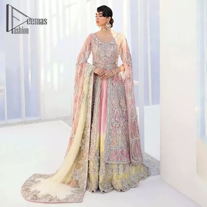 Wants regal, striking, and bold? Our tea pink maxi is all you need to bring out the queen in you. Detailing this tea pink maxi is as amazing as the front open style of maxi. Maxi is prominent with silver embroidery that involves kora, dabka, tilla, and crystal work to give you a bold and regal look on your walima day. Further, it looks super stunning when full sleeves combine with a round neckline. The maxi is coordinated with a double tone lehenga that the bottom side reflects the yellow colour to give an aesthetic and stunning look. Complete this article with the same colour dupatta that is embellished with a four-sided border.