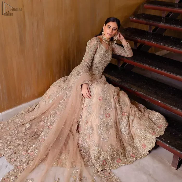 As a symbol of intense beauty and delicacy, our professional designers symbolized rose with the Tea Rose Lehenga Blouse due to its rose-like elegance and charm. An exceptionally ravishing bridal wear, specially designed in full sleeves and a graceful round neckline to give it a marvellous traditional sense. A glamorous work of silver and gold embroidery and adornment of meritorious floral motifs contributes to the supremacy of this admirable attire. The dress is made with the purest organza and follows a lehenga and a gorgeous net dupatta, finally concluding the stunning dress code and setting the dress ready for your Walima.