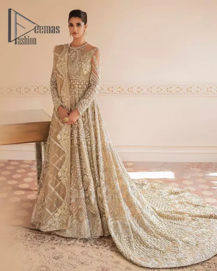 Something to Beige about! This article is specially presented by DeemasFashion featuring thoughtfully designed ensembles with a rich beige colour maxi and dupatta that are flattering on the body's quintessential details. The round neckline of the maxi is attractively combined with the back train that is heavily adorned with silver dabka, tilla,m zardozi embroidery for the finest look. In addition to this, it is paired up with the same colour dupatta that is again ornamented with \a four-sided border and sequins spray all over to fulfil your finest promising look on your walima day. 