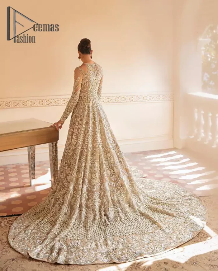 Something to Beige about! This article is specially presented by DeemasFashion featuring thoughtfully designed ensembles with a rich beige colour maxi and dupatta that are flattering on the body's quintessential details. The round neckline of the maxi is attractively combined with the back train that is heavily adorned with silver dabka, tilla,m zardozi embroidery for the finest look. In addition to this, it is paired up with the same colour dupatta that is again ornamented with \a four-sided border and sequins spray all over to fulfil your finest promising look on your walima day. 