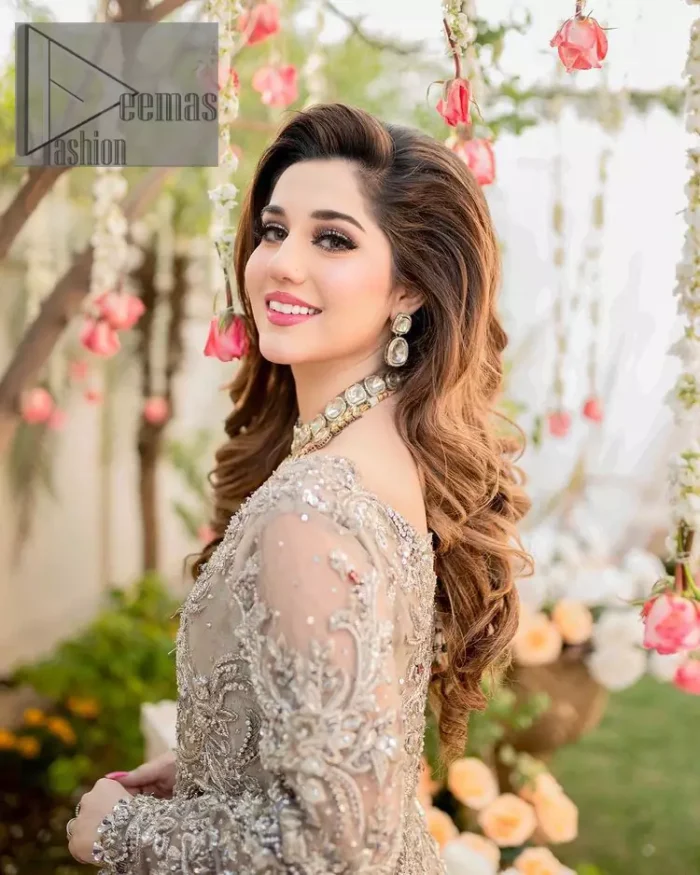 Embrace happiness on your Walima in the colour of beige-pink along this dreamiest fairy tail maxi. The floral fusion of tilla and thread embroidery on a royal beige-pink maxi is to fulfil your dreamy look. The boat shape neckline of this maxi is as amazing as the whole maxi. Further, it is fully embellished with tilla, kora, dabka and sequins work just to enhance the beauty of your Walima day. The fairy tale is also adorned with heavy work and looks super amazing when combine with full sleeves style. Finish this fairy look with the same colour dupatta that is ornamented with a four-sided border and sequins sprayed all over to increase the look of this article.