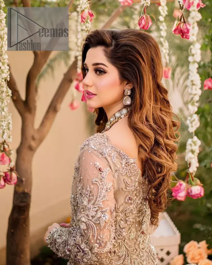 Embrace happiness on your Walima in the colour of beige-pink along this dreamiest fairy tail maxi. The floral fusion of tilla and thread embroidery on a royal beige-pink maxi is to fulfil your dreamy look. The boat shape neckline of this maxi is as amazing as the whole maxi. Further, it is fully embellished with tilla, kora, dabka and sequins work just to enhance the beauty of your Walima day. The fairy tale is also adorned with heavy work and looks super amazing when combine with full sleeves style. Finish this fairy look with the same colour dupatta that is ornamented with a four-sided border and sequins sprayed all over to increase the look of this article.