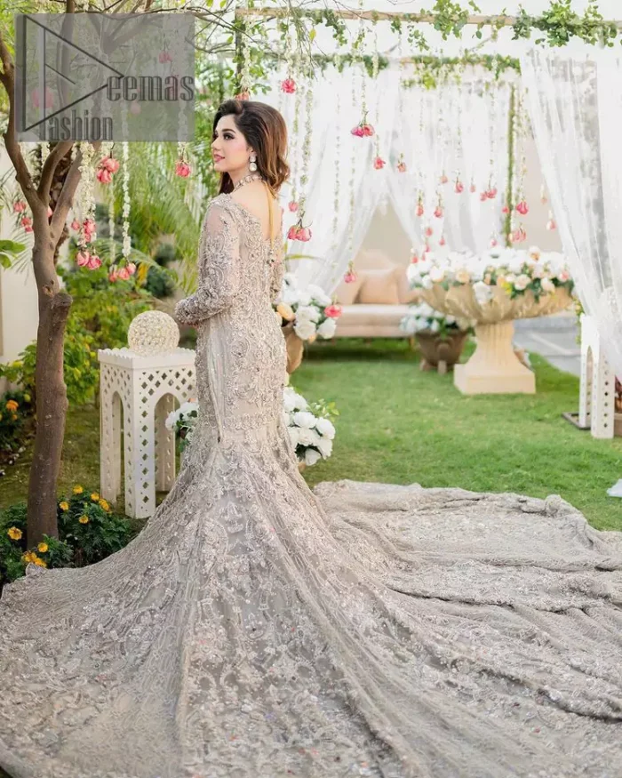 Embrace happiness on your Walima in the colour of beige-pink along this dreamiest fairy tail maxi. The floral fusion of tilla and thread embroidery on a royal beige-pink maxi is to fulfil your dreamy look. The boat shape neckline of this maxi is as amazing as the whole maxi. Further, it is fully embellished with tilla, kora, dabka and sequins work just to enhance the beauty of your Walima day. The fairy tale is also adorned with heavy work and looks super amazing when combine with full sleeves style. Finish this fairy look with the same colour dupatta that is ornamented with a four-sided border and sequins sprayed all over to increase the look of this article.